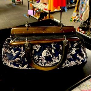 Velvet floral clutch with wooden handles